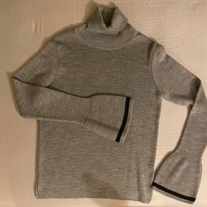 gray sweater with a high neck